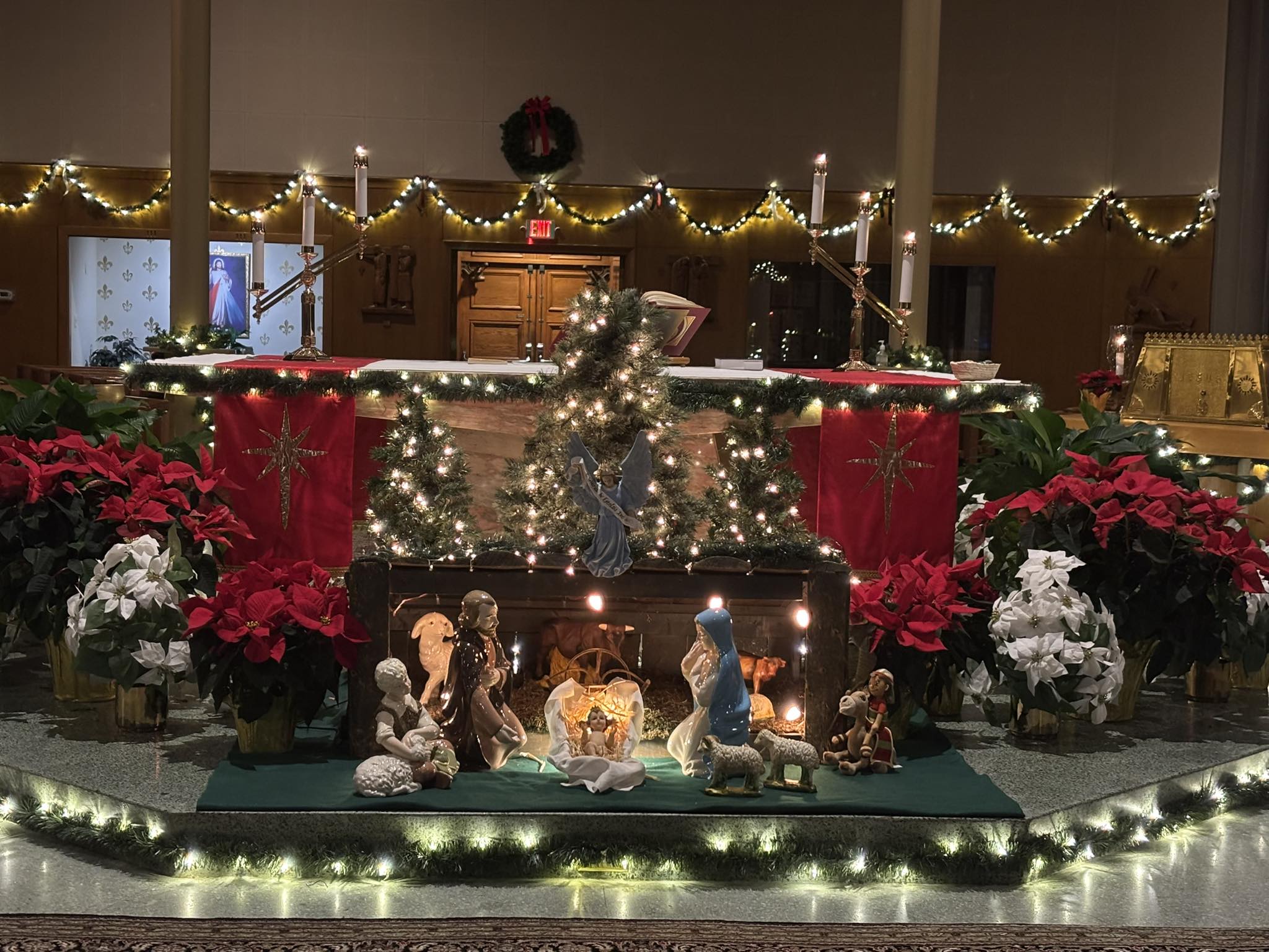 Christmas Nativity display and decorated sanctuary at Blessed Sacrament Church